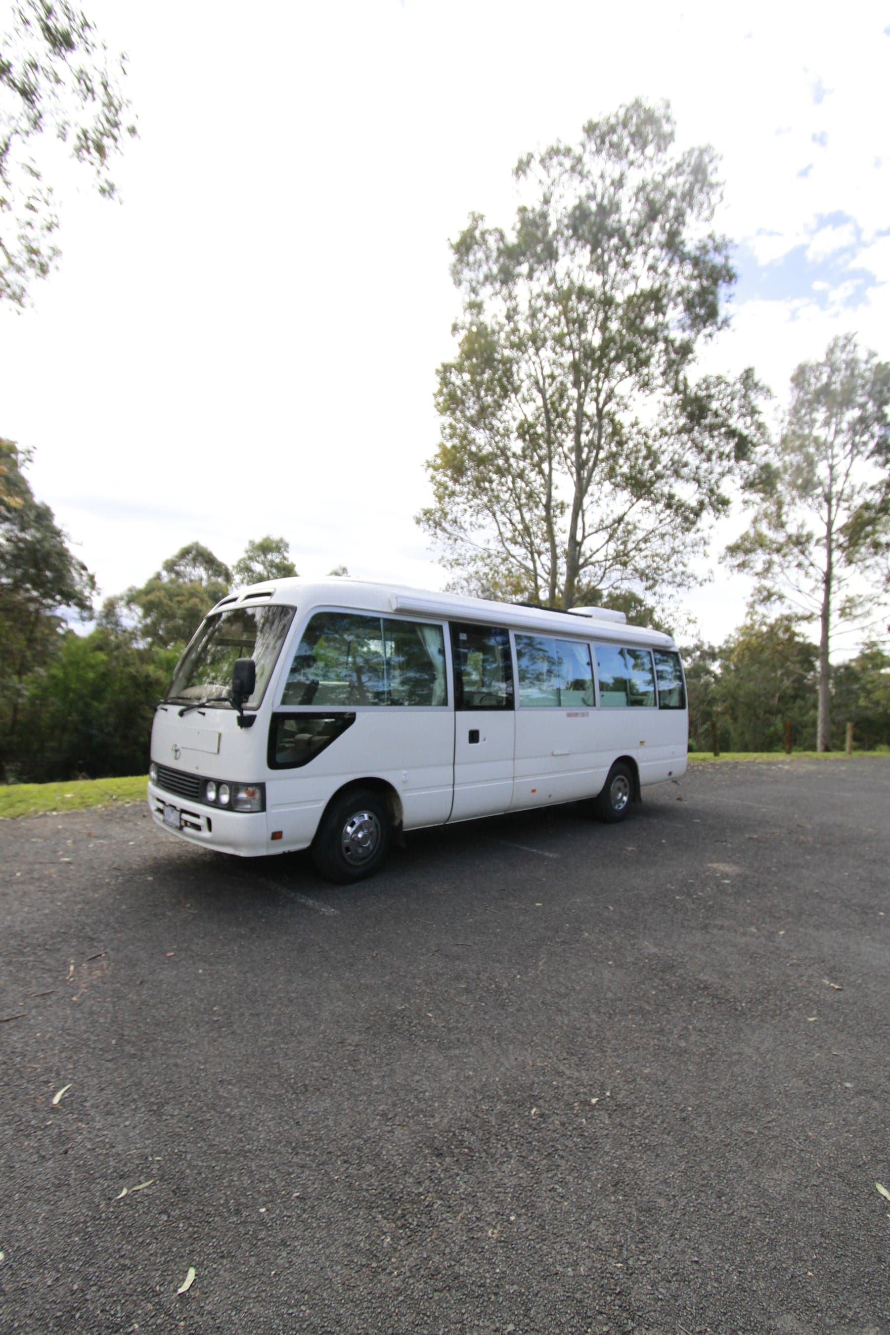Small white coach, front three-quarter view
